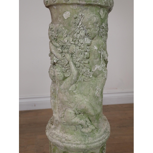 88 - A plaster decorative Corinthian Column with relief moulded decoration of children A/F 2ft 9in H