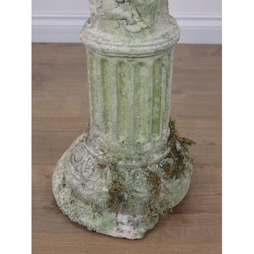 88 - A plaster decorative Corinthian Column with relief moulded decoration of children A/F 2ft 9in H