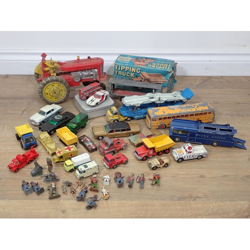 94 - A boxed Cowan de Groot Ltd battery operated Tipping Truck, battery operated Tractor, play worn dieca... 