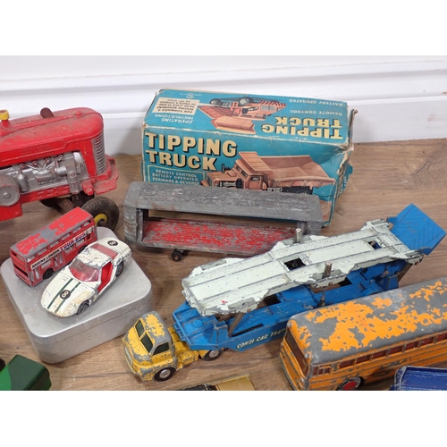 94 - A boxed Cowan de Groot Ltd battery operated Tipping Truck, battery operated Tractor, play worn dieca... 