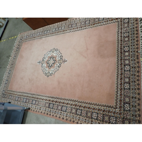 523 - A pink ground Carpet with multiple borders 10ft L x 6ft 6in W