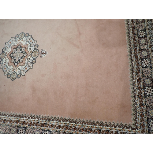 523 - A pink ground Carpet with multiple borders 10ft L x 6ft 6in W