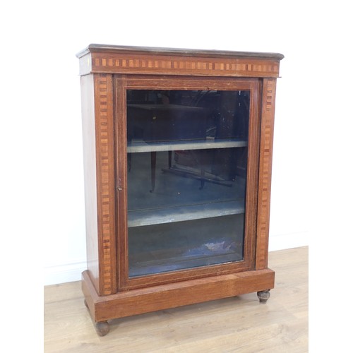 441 - A 19th Century mahogany and inlaid Music Cabinet fitted single glazed door