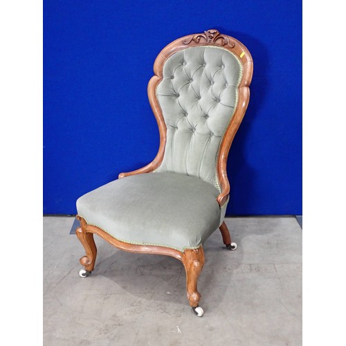 122A - An Edwardian walnut spoon back Chair with green button upholstery, and a cushion depicting a huntsma... 