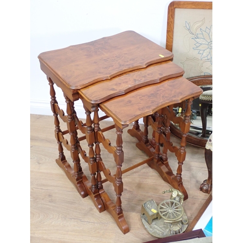 106 - A nest of mahogany Occasional Tables, a Footstool on claw and ball feet, an oval Mirror, various Pri... 