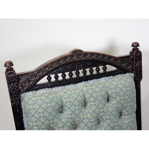 109 - A Victorian ebonised blue upholstered button back Nursing Chair