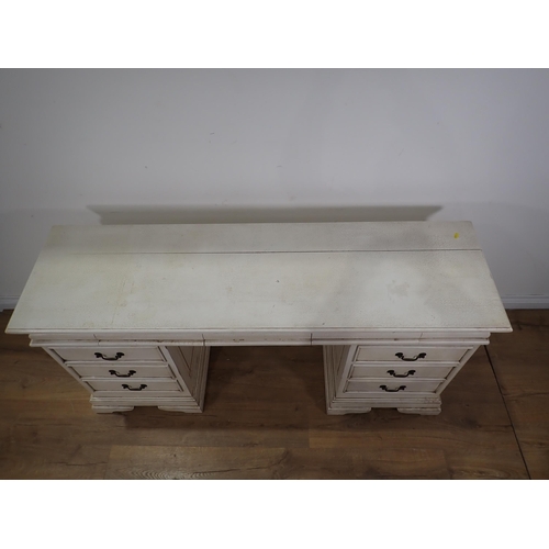 114 - A white painted Dressing Table fitted nine drawers 4ft11in W x 2ft 5in H