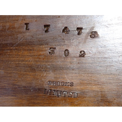 115 - An Edwardian walnut effect Stool stamped Brooks Limited and a hardwood Coffee Table