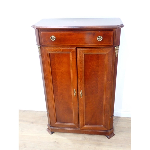 14 - A mahogany veneered two door Cupboard fitted single drawer above 4ft 6in H x 2ft 10in W