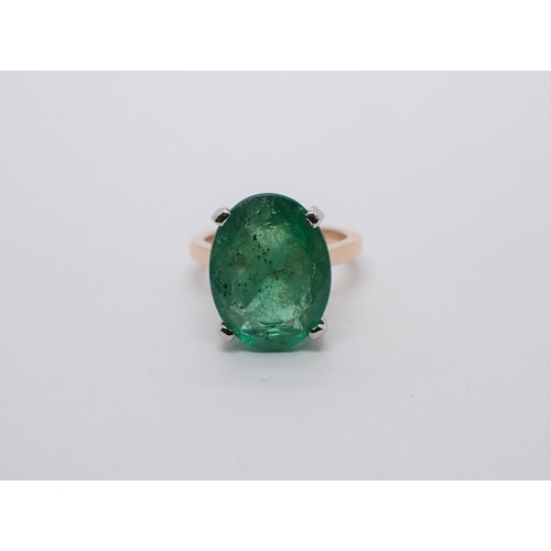 163 - An Emerald single stone Ring claw-set oval-cut stone, 6.62cts, in 18ct gold and platinum, ring size ... 