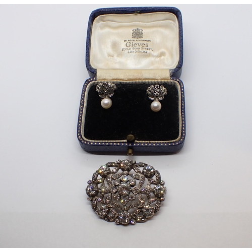 164 - A Diamanté Brooch in white metal and a pair of marcasite and cultured pearl Earrings stamped SILVER ... 