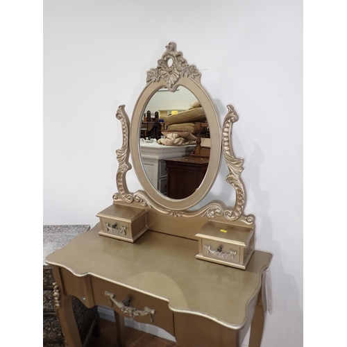 34 - A modern gold painted Dressing Table and a metal covered bombe Chest of drawers