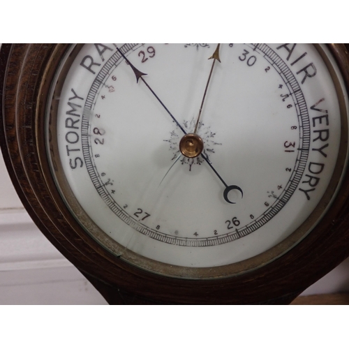 41 - A carved oak aneroid Barometer by James Lucking & Co, Birmingham and another Barometer A/F