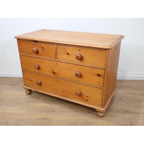 46 - A Victorian pine Chest of two short and two long drawers raised on bun feet 3ft 6in W x 2ft 5in H