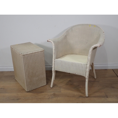 62 - A white painted wicker Tub Chair and a Linen Basket