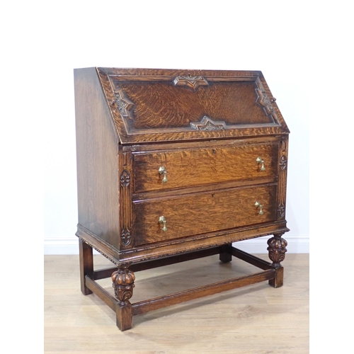 87 - A moulded oak Bureau and a modern oak veneered Chest of five drawers