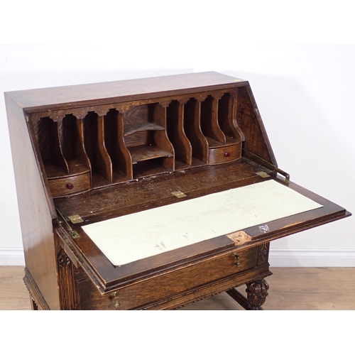 87 - A moulded oak Bureau and a modern oak veneered Chest of five drawers