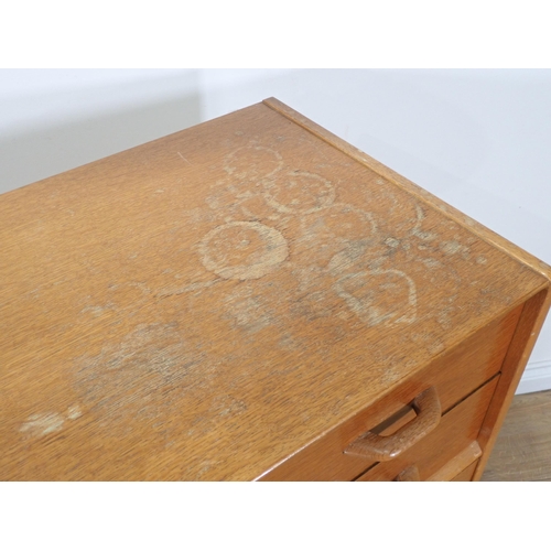 87 - A moulded oak Bureau and a modern oak veneered Chest of five drawers