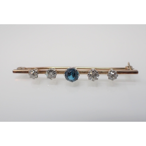 144 - A blue Zircon and Diamond Brooch claw-set round zircon between four old-cut diamonds mounted on simp... 