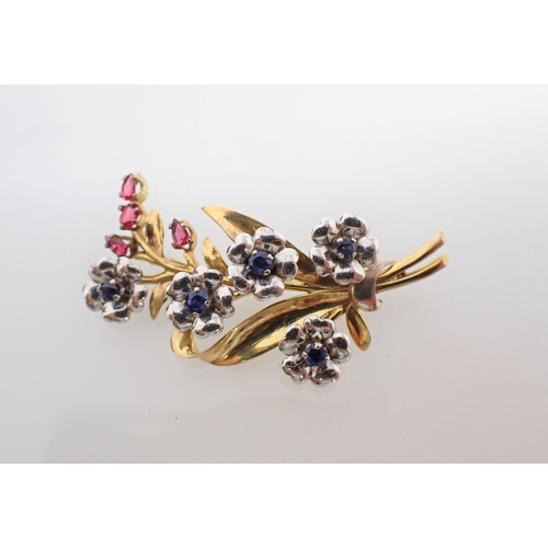 145 - A Sapphire and Spinel flower Spray Brooch claw-set round sapphires to flower centres and oval-cut re... 