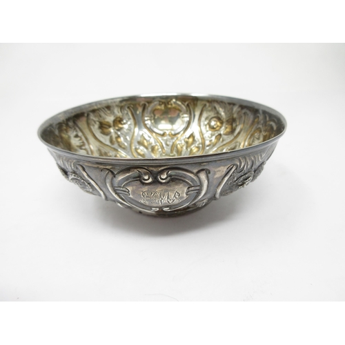 15 - A Victorian silver circular Bowl with finely embossed and chased panels, Birmingham 1889, maker: Hil... 