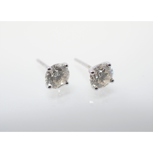 158 - A pair of Diamond Ear Studs each claw-set brilliant-cut stone in 18ct white gold, total diamond weig... 