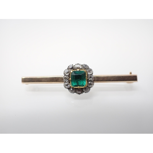 167 - An Emerald and Diamond Brooch set foil backed cushion-cut emerald within a frame of close-set old-cu... 