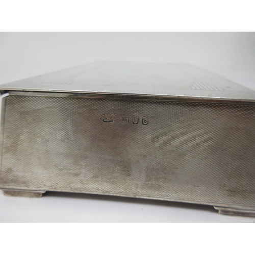 18 - A George VI silver Art Deco Cigarette Box with engine turning, London 1938, 7in x 4in