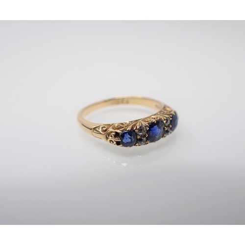 183 - A Sapphire and Diamond Ring pavé-set three cushion cut sapphires interspersed with pairs of old-cut ... 