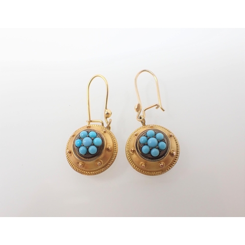 194 - A pair of Turquoise drop Earrings each set cluster of round stones in beaded frame on wire fittings,... 