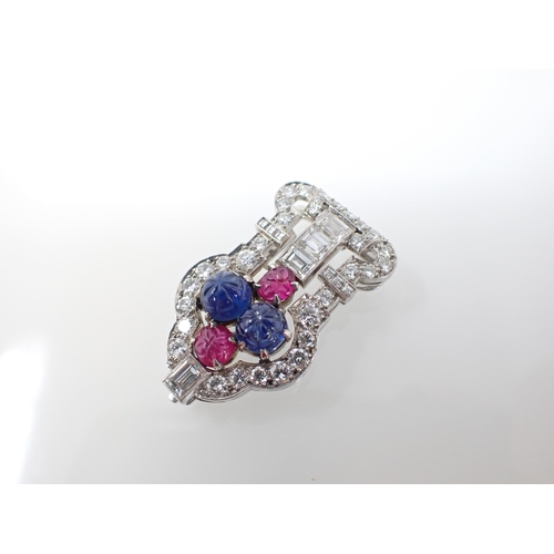 196 - A 1930's gem-set 'Tutti Frutti' Clip claw-set two carved sapphire cabochons, two carved ruby cabocho... 