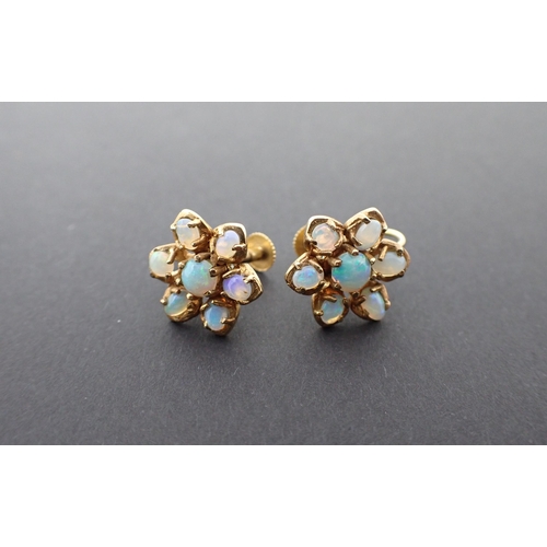 201 - A pair of Opal Flower Cluster Earrings claw-set round cabochon within frame of six oval cabochons on... 