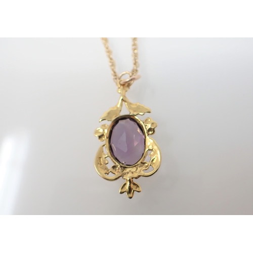 202 - An Amethyst Pendant claw-set oval-cut stone in foliate frame on chain stamped 9ct.