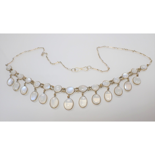 204 - An early 20th Century Moonstone Fringe Necklace spectacle-set round and oval cabochons on fine chain