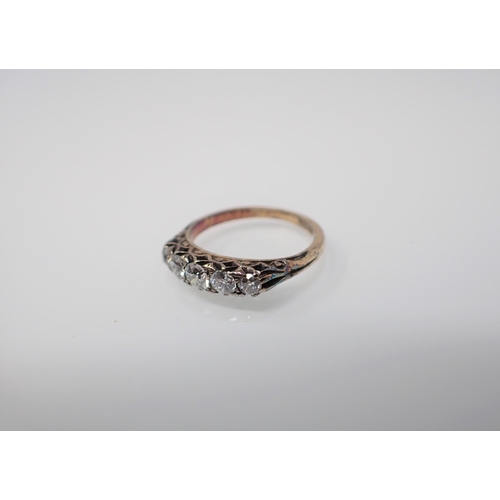 215 - A Diamond five stone Ring pavé-set graduated old-cut stones stamped 18, ring size I 1/2.