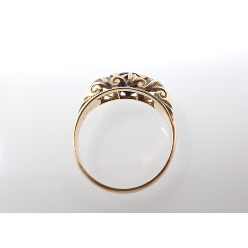 220 - A Sapphire and Diamond three stone Ring claw-set cushion-cut sapphire between two old-cut diamonds, ... 