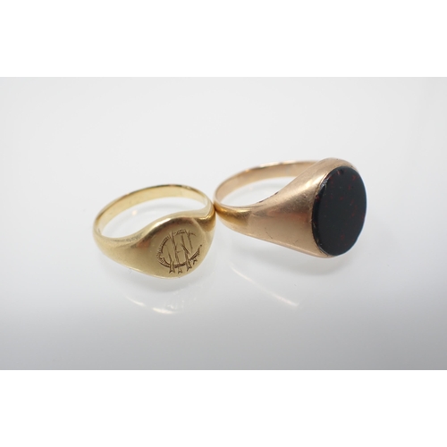 242 - A Signet Ring engraved monogram, stamped 18ct, ring size L, approx 5.20gms and a Signet Ring set blo... 