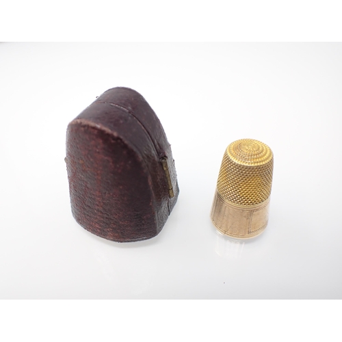 263 - A gold Thimble in leather case, unmarked, approx 3.10gms