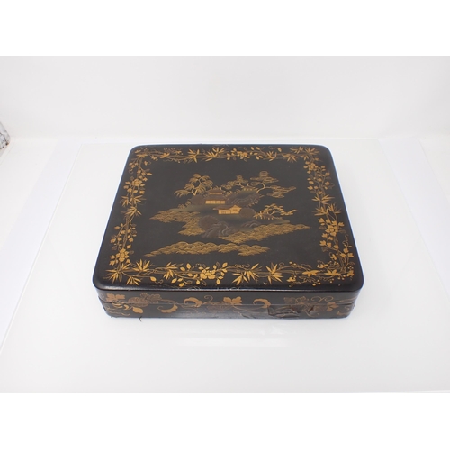 264 - A 19th Century Chinese laquered Box fitted five smaller boxes decorated pagodas containing approx 26... 