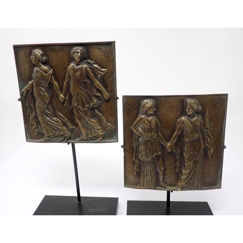 271 - A pair of French bronze Plaques on stands embossed classical figures a late 18th Century French bron... 