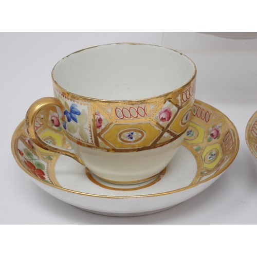 347 - A Coalport two handled Cup and Saucer with gilt borders, pink rose and other floral panels on yellow... 