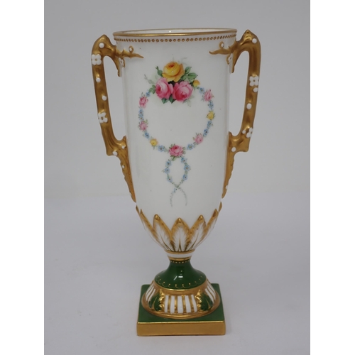 362 - A Royal Worcester two handled Vase with floral garlands, gilt branch handle on stepped base, two por... 