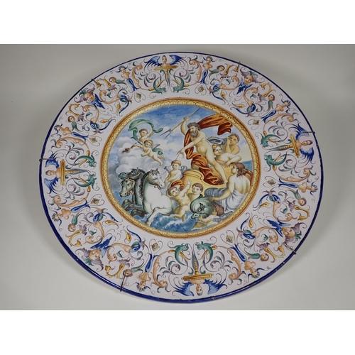 370 - A large pair of Italian Majolica Chargers, central panels of allegorical figures, on chariot, angels... 