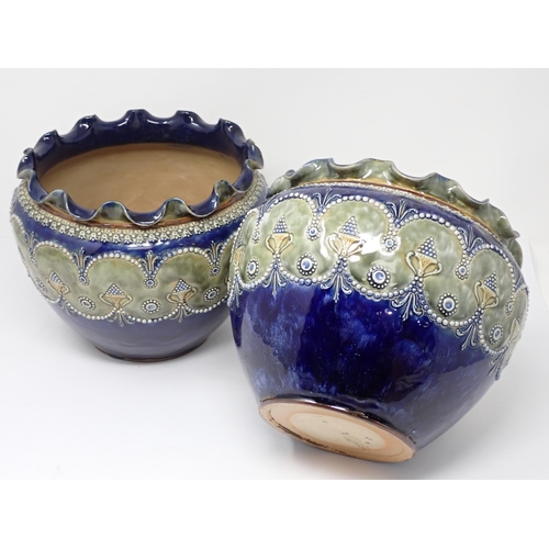 384 - A pair of Royal Doulton Jardinieres with floral rims and raised moulded bands of decoration, 9in dia... 