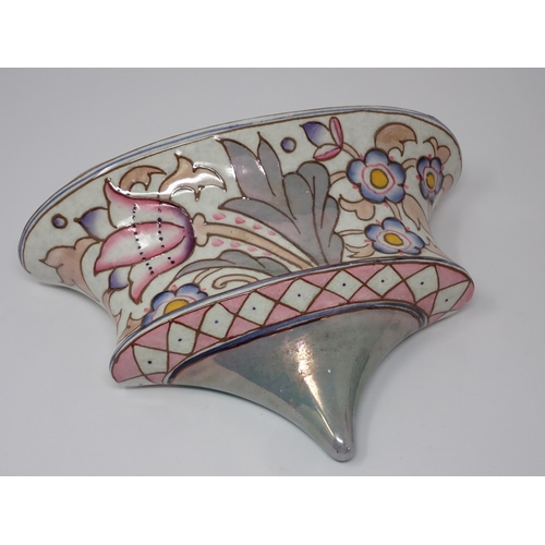 385 - A Charlotte Rhead Bursley Ware Wall Pocket and matching Table Lamp, decorated stylised flowers in co... 