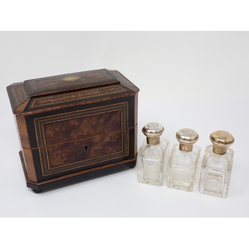 388 - A burr wood and brass inlaid scent bottle Box the lined interior containing three plated mounted Sce... 