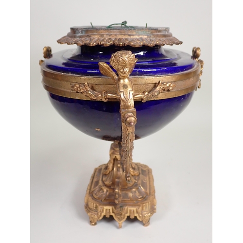 390 - A blue porcelain and gilt metal Jardiniere, possibly French, with winged cherub handles to the oval ... 