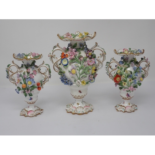 391 - A Dresden three piece Garniture of two handled Vases, each floral encrusted and painted small insect... 