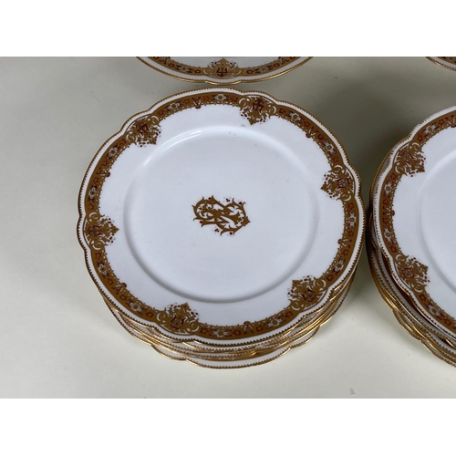 396 - A French porcelain Dessert Service with gilt Armorial motif surrounded by gilt and floral borders st... 