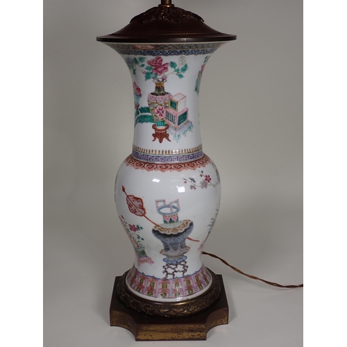 413 - A Chinese Vase with famille rose enamels, scenes of urns and flowers with decorative bands and ormol... 